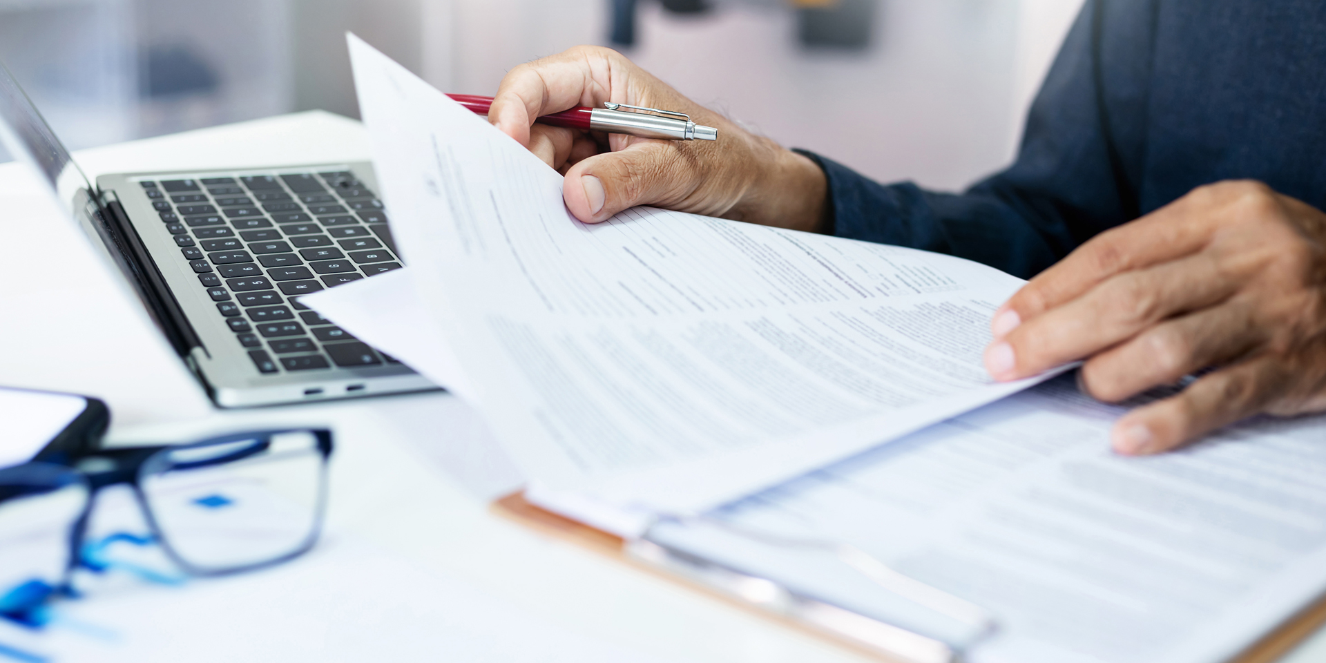 Person reviewing papers