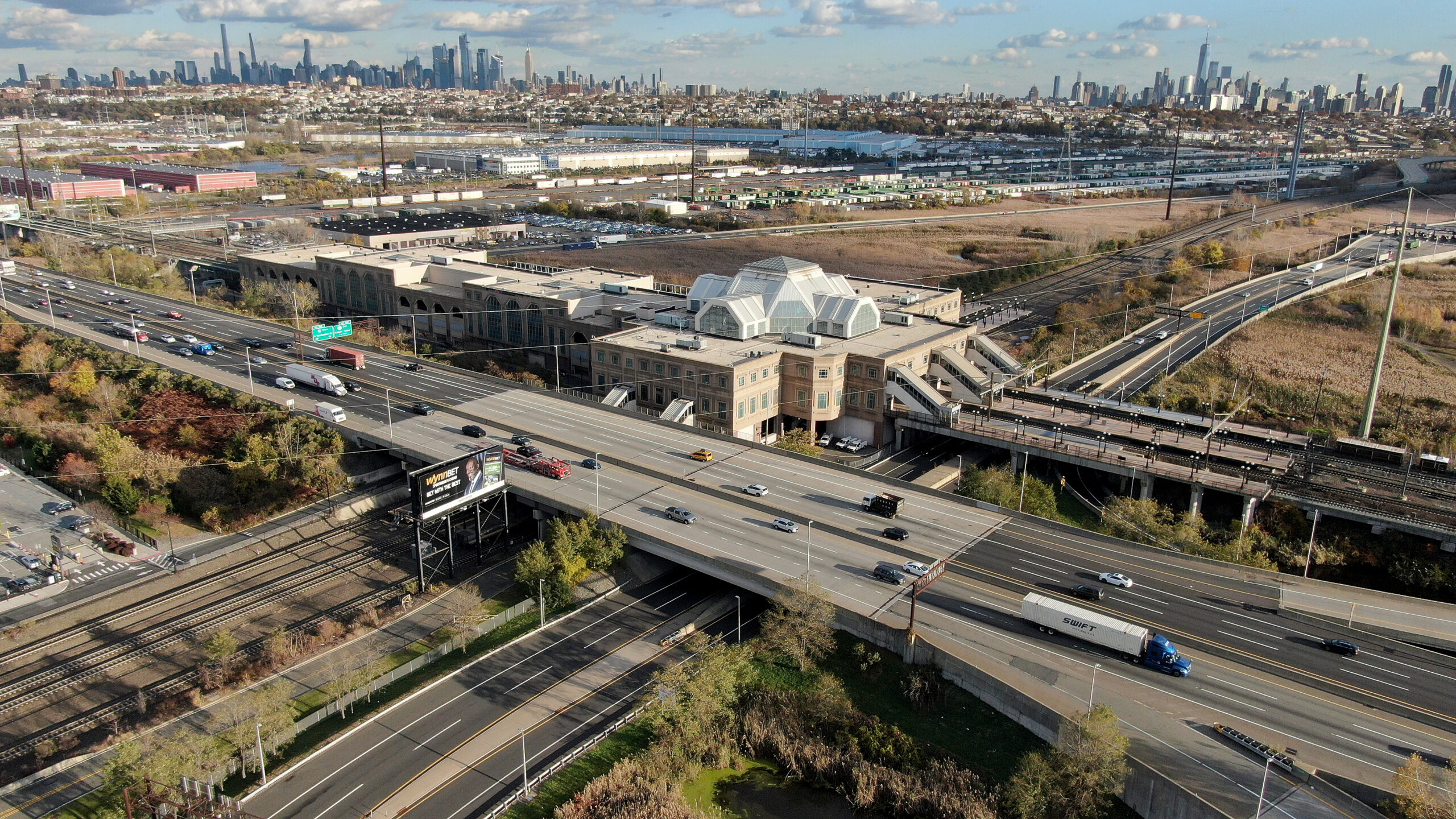 Secaucus Junction NJ TRANSIT rail station shown alongside the New Jersey Turnpike. 