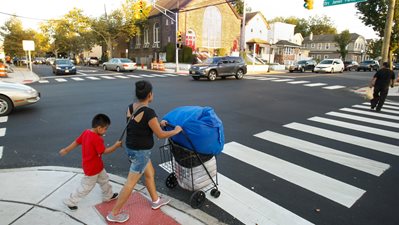 mother and son crossing the street