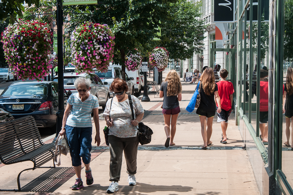 Senior citizens walking on sidewalk