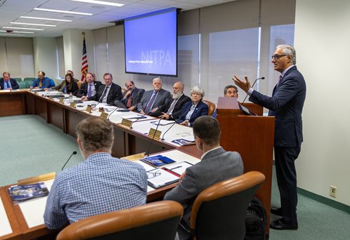 NJ Transit President and CEO Kris Kolluri speaks at the podium in front of NJTPA Board of Trustees