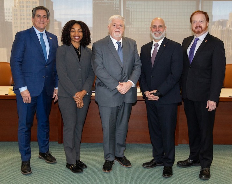 NJTPA Board Executive Committee stands in Board room.