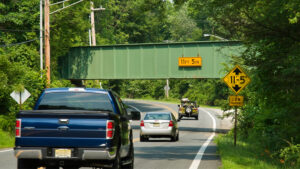 Completed high risk rural roads project on Berkshire Valley Road in Roxbury. Warning signs and flashing lights were installed in advance of a low freight railroad overpass.