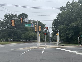 Ryders Lane street sign hangs above empty intersection