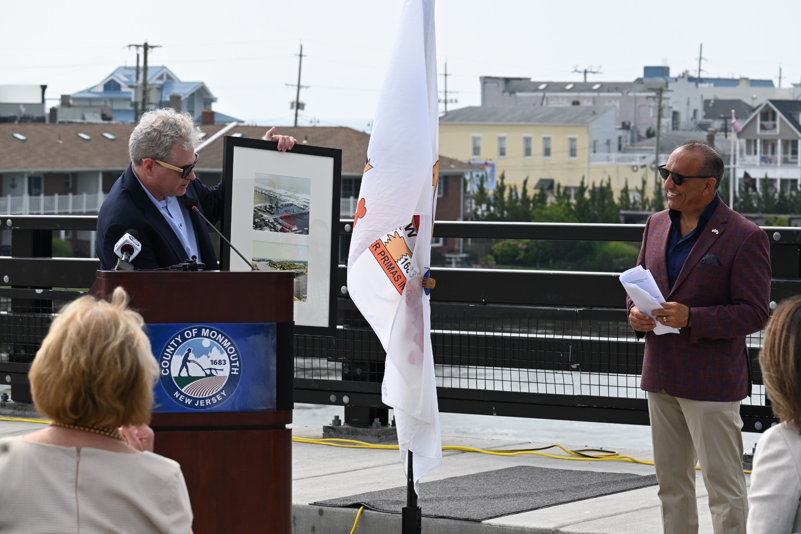 Sea Bright Mayor Brian Kelly presents Monmouth County Commissioner Director Tom Arnone with a framed photo