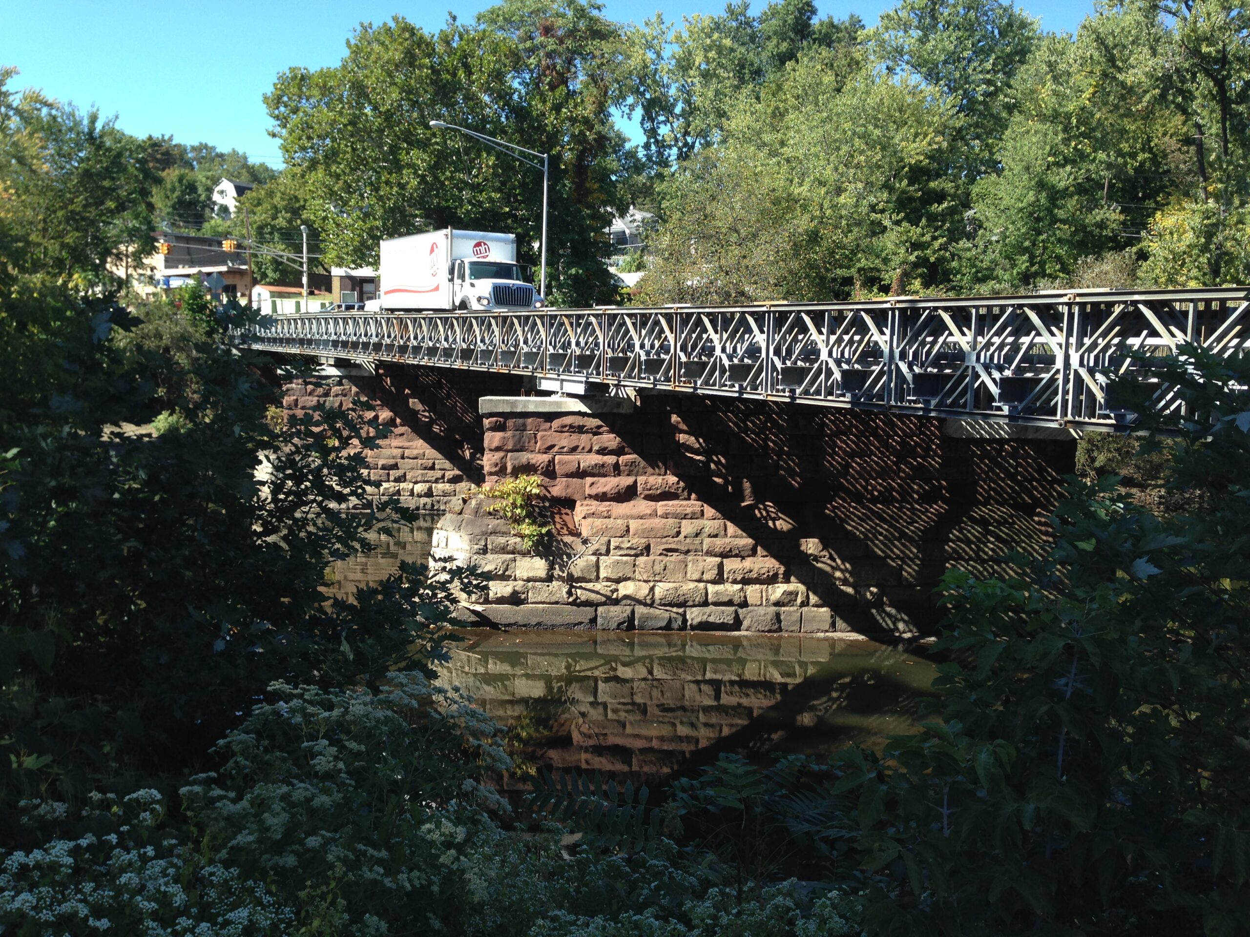 A truck drives over the Sixth Avenue Bridge over the Passaic River in Paterson.