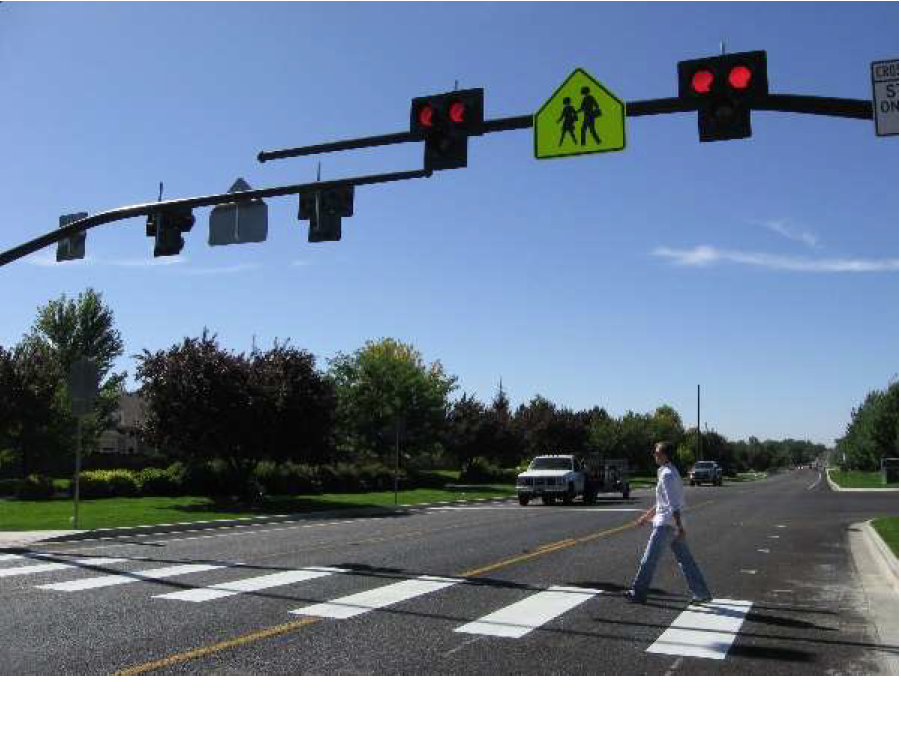 A pedestrian crosses at an intersection