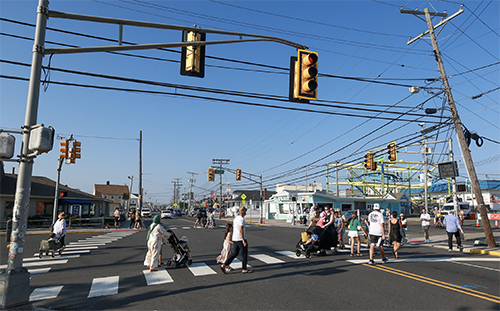 people in crosswalk at intersection