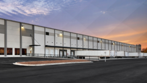 Class A industrial warehouse with trailers parked at loading docks.