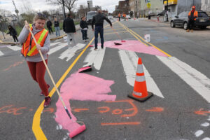 People paint intersection as part of traffic calming measures at Monticello Avenue in Jersey City.