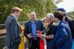 Wanaque Mayor Dan Mahler speaks with Commissioner John Bartlett and other officials after cutting the ribbon on Highlands Rail Trail.