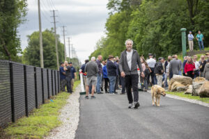 Man walks ahead of group on Pompton Valley Rail Trail