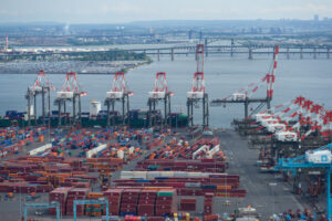 Aerial image of Newark-Elizabeth section of Port of New York and New Jersey with bridges in background.